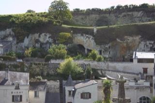 Village beneath limestone cliffs