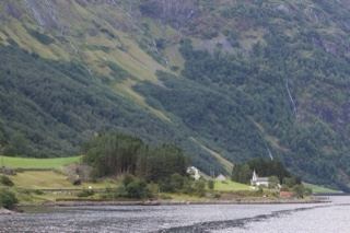 Fjord Valley with Church Under Mountains