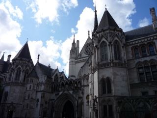 Gothic Courthouse Facade Under Cloudy Sky