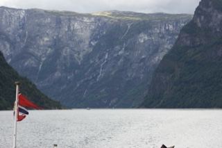 Norwegian Fjord with Mountains and Flag