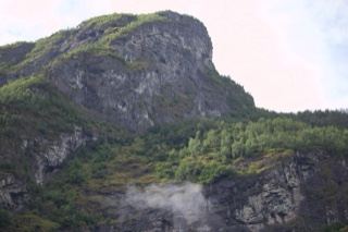 Rugged Mountain Cliff With Mist