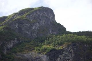 Rugged Mountain Cliff with Forest