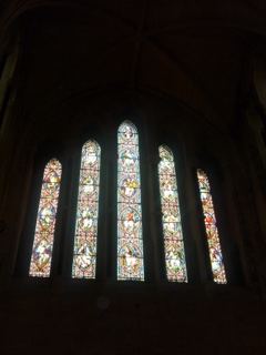 Stained Glass Windows in Dark Church Interior
