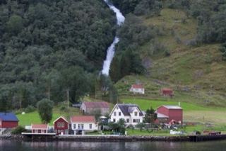 Rural Fjord Village With Waterfall