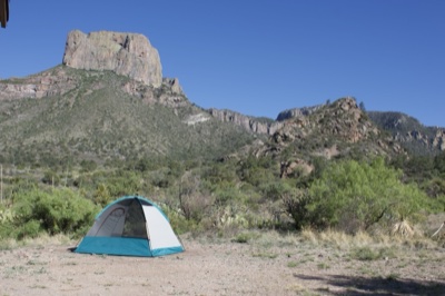 Camping Tent Under Rocky Mountain