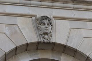 Stone mascaron on building facade