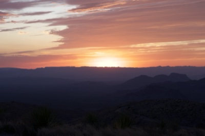 Sunset Over Layered Desert Mountains