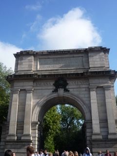 Stone triumphal arch under blue sky