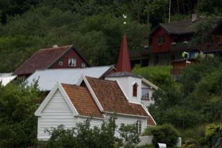 Houses and Church Steeple on Hillside