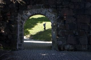 Stone Archway Leading to Grass Lawn