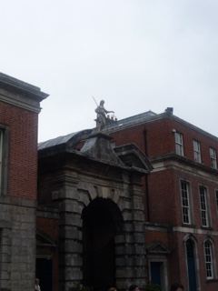 Historic Brick Gate with Statue