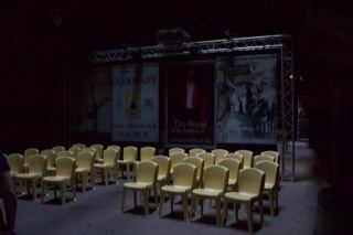 Empty auditorium with yellow chairs