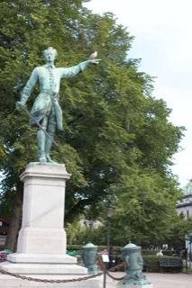 Bronze Statue in Park with Trees