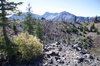 Volcanic crater with mountains background