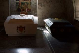 Two sarcophagi in dim chapel interior