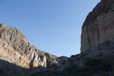 Sunlit Canyon With Steep Rock Walls