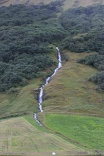 Mountain Waterfall Cascading Down Hillside