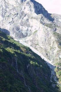 Rugged Mountain Slope with Waterfall