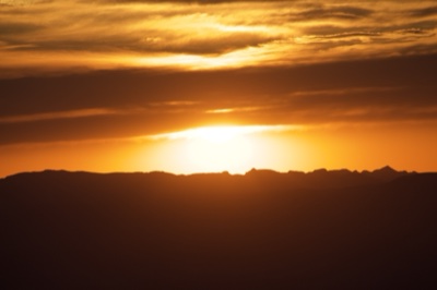 Sunset Over Mountain Silhouette