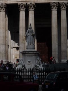 Statue before neoclassical colonnade London